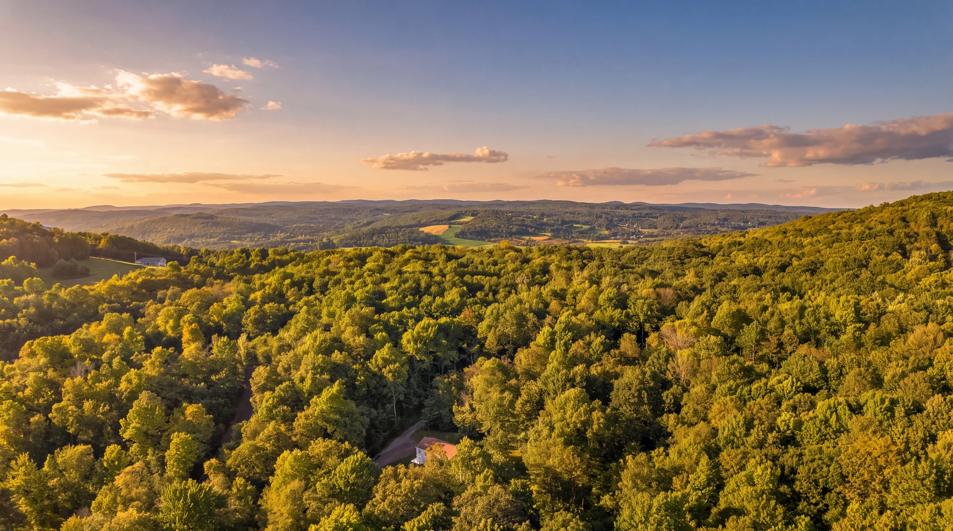 Kevin Lucero's team flying drone photography at an Upstate NY farmhouse listing